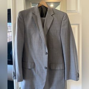 Michal Kohrs gray pinstripe suit